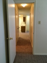 Hall from Master Bedroom, past 2nd Bedroom, to Living, Dining, Kitchen